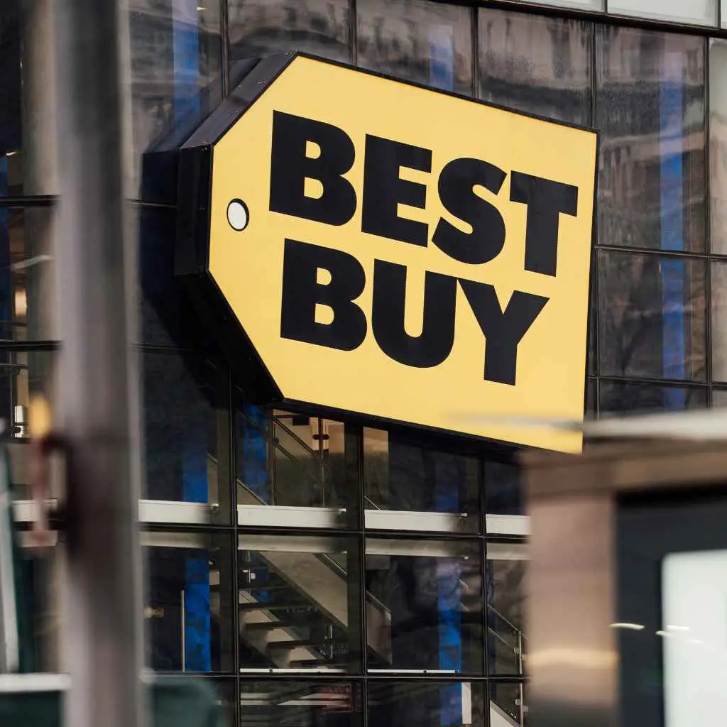 Exterior of a big-box electronics store with blue and yellow branding