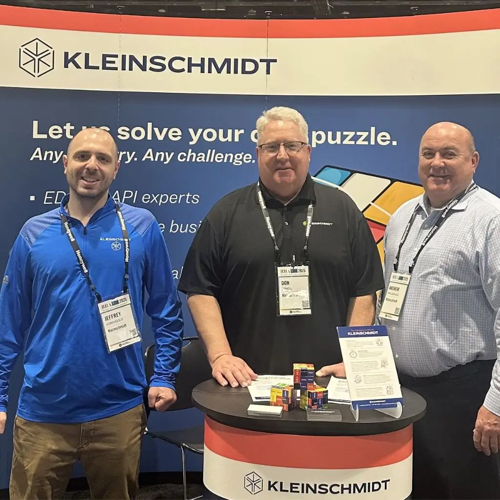 Image of three data integration supply chain sales reps at a conference