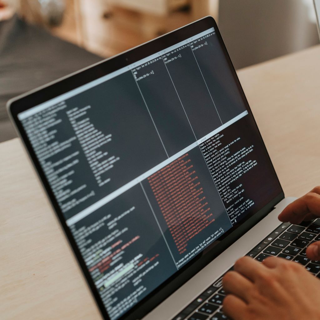 Image of a computer with code busting the myth of pre-build EDI maps